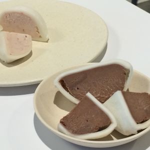 Oki Mochi - A hearty dollop of our housemade ice cream handwrapped in a delightfully chewy, lightly sweet rice mochi. Flavors: chocolate, vanilla, green tea, mango, strawberry. at Oki Momo in San Luis Obispo