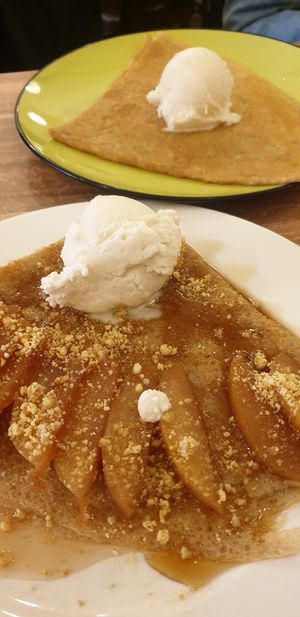 Apple crepe on the foreground with lemon and sugar crepe in the background at Rue de Creperie in Fitzroy