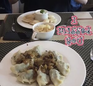 Vegan dumplings with spinach, tofu, and tomatoes & vegan sauerkraut salad at Pierogarnia Mandu Oliwa in Gdansk