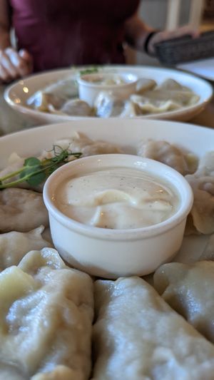 Vegan Piroggi filled with vegan minced meat, vegan cheddar, vegan Mayo, Ketchup and vegan Mayo as a Dip at Pierogarnia Mandu Oliwa in Gdansk