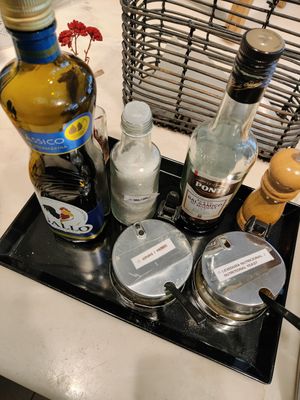 Oil, spices, nutritional yeast and other condiments at daTerra - Baixa in Porto