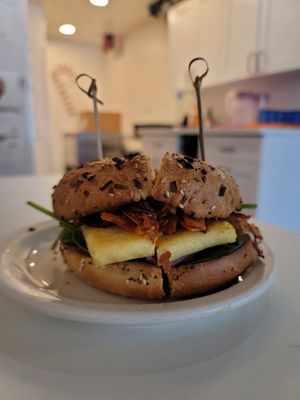 Vegan breakfast bagel. You have the choice of plain onion and everything bagel. The coconut bacon is to die for! at Morning Brew - Kailua in Kailua