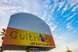 Sign out front heading west on scenic 98 at Cultivate Cafe in Destin