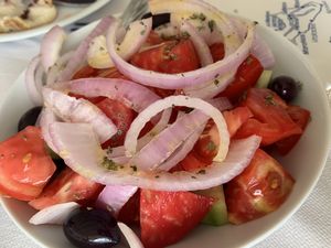 Tomato, cucumber and onion salad  at Imerolia Beach Restaurant in Corfu