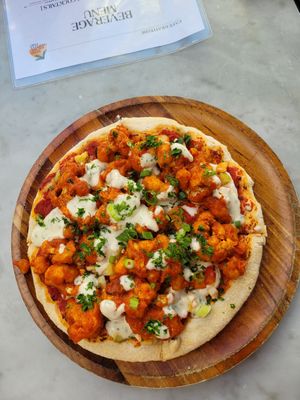 Coliflower buffalo style pizza at Cafe Gratitude in San Diego