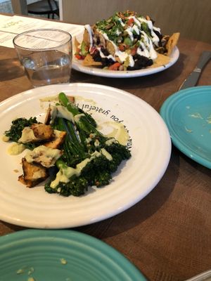 Broccolini with tempeh & avocado coconut cream sauce at Cafe Gratitude in San Diego