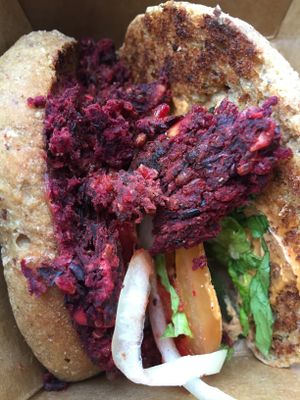 black bean burger, with crunchy ingredients--not a sought-after texture! at Cafe Gratitude in San Diego