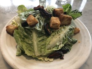 Caesar’s salad with mushroom “bacon" at Cafe Gratitude in San Diego