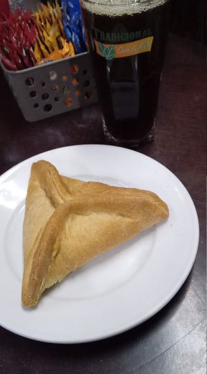 Esfirra de soja com calabresa vegetal + mate com limão (pequeno, mas notem o tamanho do copo!l at Tradicional Casa do Mate in Sao Paulo