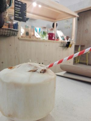 Coconut water with cardboard straw ! at Väcka in Barcelona