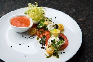 Tomato salad with mozzarella di bufala 'New for summer 2019 menu' at Etnosvet in Prague