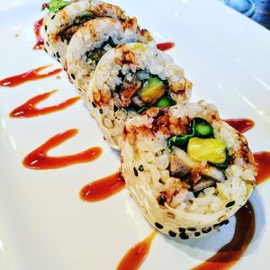 Shojin roll (BBQ seitan, grilled asparagus, pineapple, shallot, bib lettuce, nori, brown rice, soy paper, sweet soy) at Blue Sushi Sake Grill in Denver