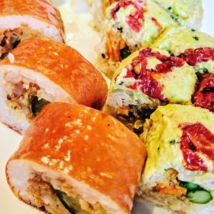Cowgirl roll (pickle vegan tempura, sriracha-fried onion rings, vegan mayo, BBQ paper) 

Eden roll (sweet potato vegan tempura, grilled asparagus, edamame hummus, sun-dried tomato, brown rice, soy paper, olive oil) at Blue Sushi Sake Grill in Denver