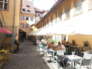 Outside seating area of hidden cafe Leander at Cafe Leander in Bamberg