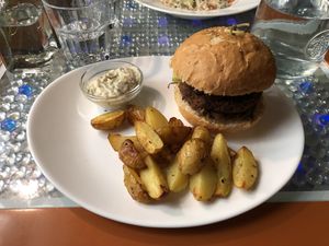Vegan burger with potato wedges at Clear Head - Lehka Hlava in Prague