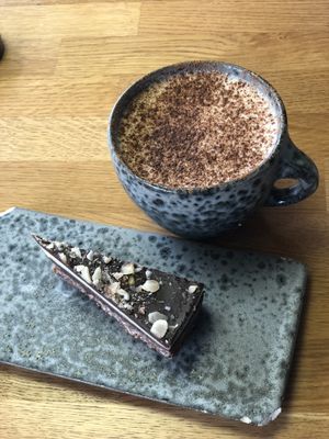 Triple chocolate cake and chai latte  at 42°Raw in Frederiksberg