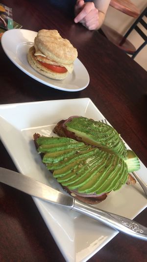 Avocado toast and breakfast sandwich with tempeh, tomato, and vegan pepper jack!  at Green Street Market in Rio Grande