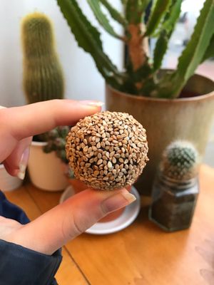 Sesame almond date ball at ROOTS - Amstelveenseweg in Amsterdam