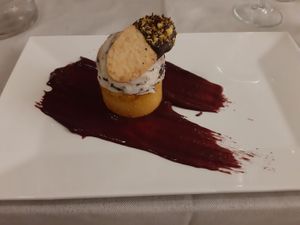 Sponge cake with chocolate chip ice cream and blueberry sauce at BistroBio in Milan