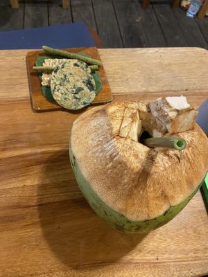 Gluten-free crackers with algaes and fresh cold coconut  at Alkaline Restaurant in Canggu