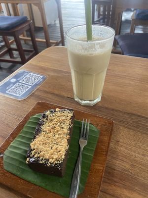 Sweet potato brownie and iced latte with oat milk   at Alkaline Restaurant in Canggu