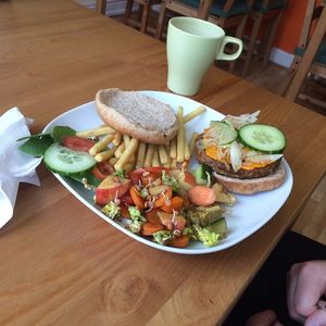 Cheeseburger with salad and fries. at The Green Room in Warrington