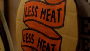 less meat, less heat photobooth sign at VeganBurg in San Francisco