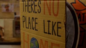 there's no place like home with a globe sign at VeganBurg in San Francisco