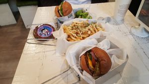 Burgers, garlic fries and cookie at VeganBurg in San Francisco