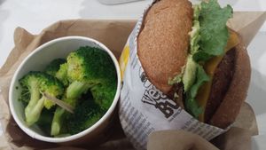 Super delicious burger w/side of broccoli!! at VeganBurg in San Francisco