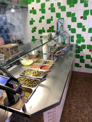 Wide selection of fresh toppings at Maoz - Albertcuypstraat in Amsterdam