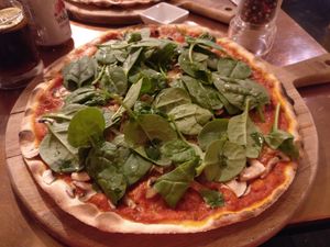 Pizza with vegan cheese, mushrooms, onion and spinach. at In Bocca Al Lupo in Lisbon
