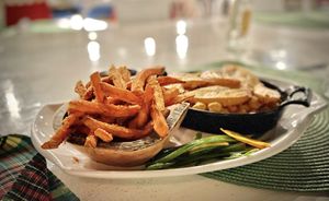 Chickpeas Stack with sweet potato fries and ambiance 👌🏽  at Miss T's Kitchen in Ocho Rios