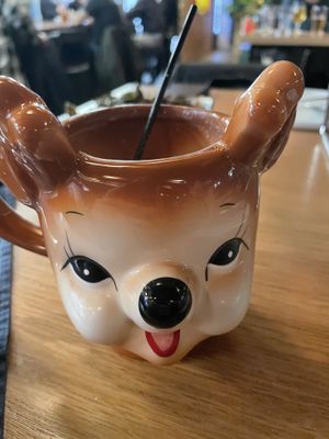 Yummy vegan seasonal cocktail with coconut milk and creepy cute mug  at Trophy Brewing in Raleigh