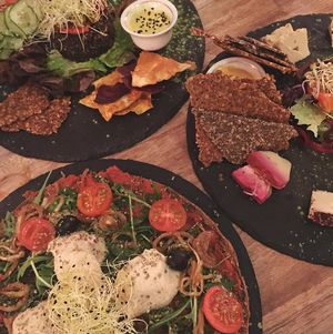 Pizza, cheese plate and burger at Rawtastic in Berlin