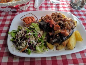 Eggplant with salad and potato wedges at Food House in Mostar