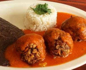 Albondigas de avena y nuez en salsa de jitomate y chipotle
acompañadas de arroz y frijoles

vegan meatballs 
oats and nuts mixed with shreadded carrots
served with tomato and chipotle pepper
accompanied with rice and beans at Las Delicias Fonda Vegana y Vegetariana  in Cancun