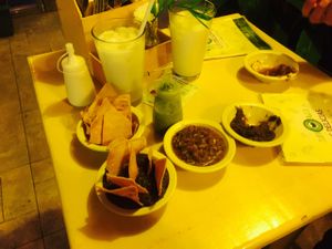 Best spicy salsa in Cancun! Delicious black refried beans. The green sauce in the bottle is super spicy and amazing! at Las Delicias Fonda Vegana y Vegetariana  in Cancun