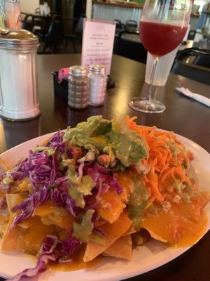 Half order of classic nachos with hibiscus kombucha  at Viva Vegeria in San Antonio