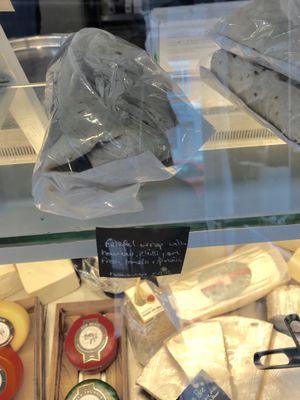 Falafel and hummus vegan wrap out on the counter. at Deli Flavour in Leicester