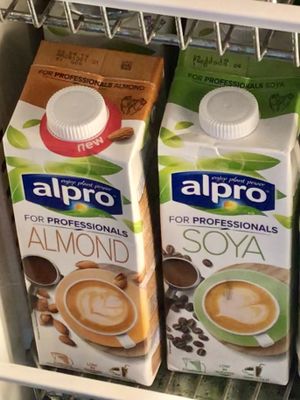 Alpro For Professionals almond and soya milk in the fridge at Deli Flavour in Leicester
