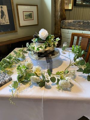 A small celebration cake made to order  at The Wallflower Cafe in Herne Bay