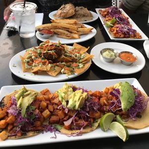 Potato Tacos (front), Fried Guacamole, fries, Biscuits & Gravy at The Coronado PHX in Phoenix