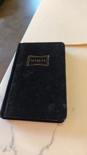 Book of secrets that served as the bill carrier, and also a place to write notes in at The Coronado PHX in Phoenix