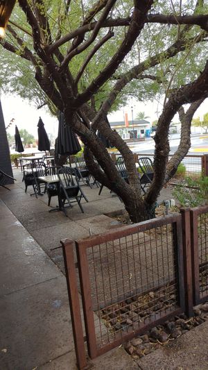 Outside. It's raining! Normally this would be a nice area and I would definitely have eaten outside if it didn't seem like rain was coming. at The Coronado PHX in Phoenix