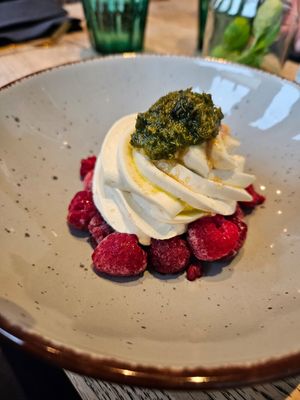 Iced raspberries with coconut cream and mint pesto at Kunstküche in Krefeld