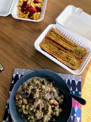 Creamy mushroom and vegan chicken pasta, garlic bread and cheesy nachos at Cafe Shanti in Lincoln