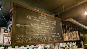Blackboard with changing daily specials at Gigi Pizzeria in Newtown