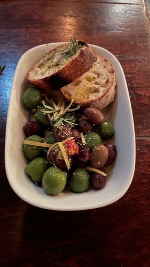 Marinated mixed Italian olives served with homemade bread  at Gigi Pizzeria in Newtown