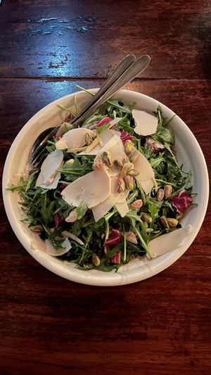 Rucola, Merle E Cannella - Salad of rocket, radicchio, sun dried apple, pistachio, cinnamon, extra virgin oil, shaved Parmesan, sea salt & lemon zest.  at Gigi Pizzeria in Newtown